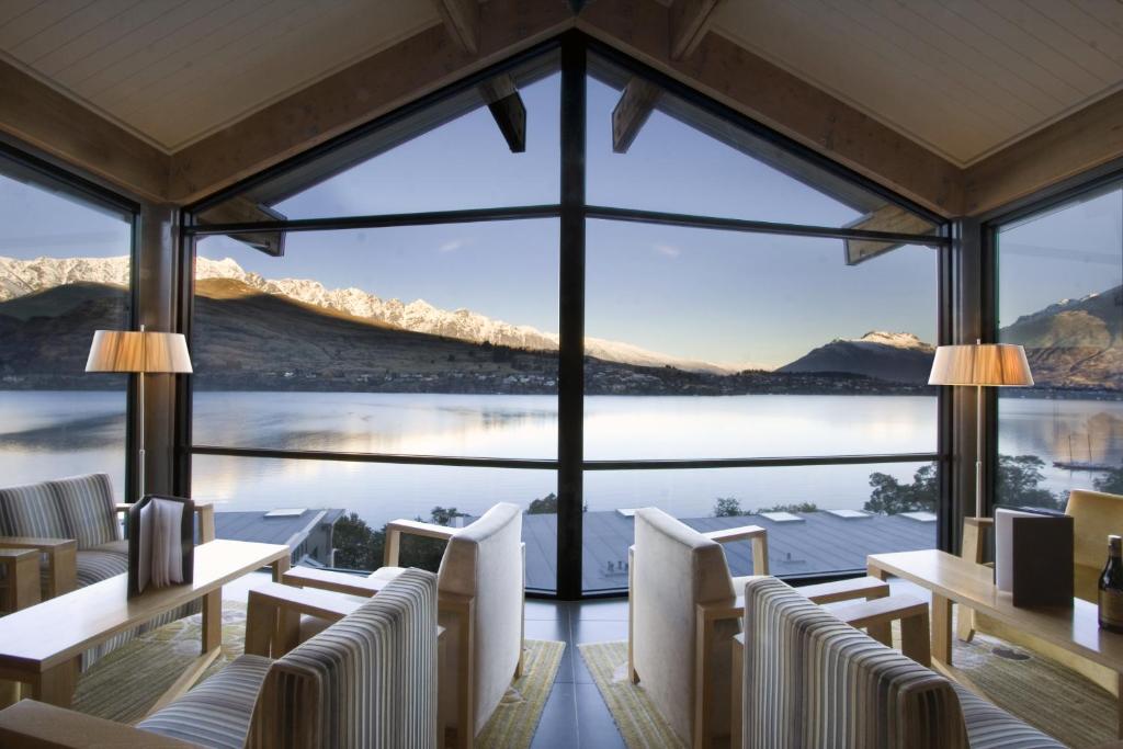 a hotel room with a view of the ocean at The Rees Hotel & Luxury Apartments in Queenstown