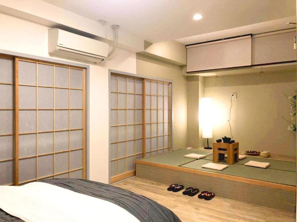 Postel nebo postele na pokoji v ubytování KEYHOTEL-5minutes for walk to Akihabara Electric Town
