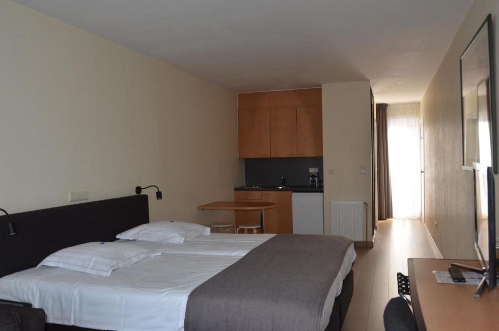 Postel nebo postele na pokoji v ubytování Hotel Arcato