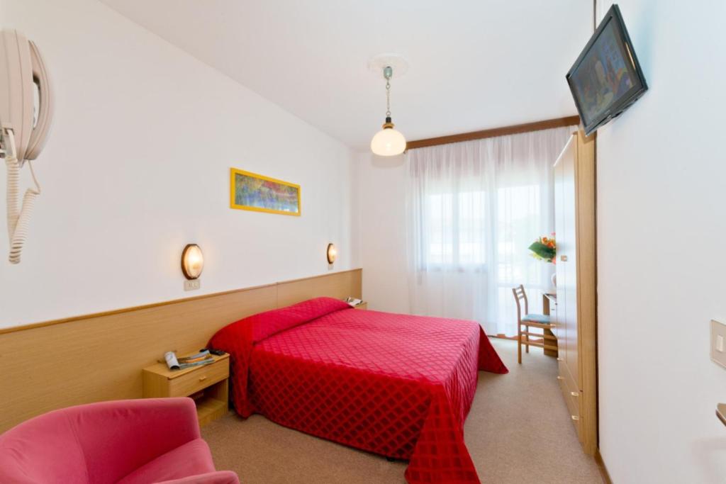 Postel nebo postele na pokoji v ubytování Hotel Corallo