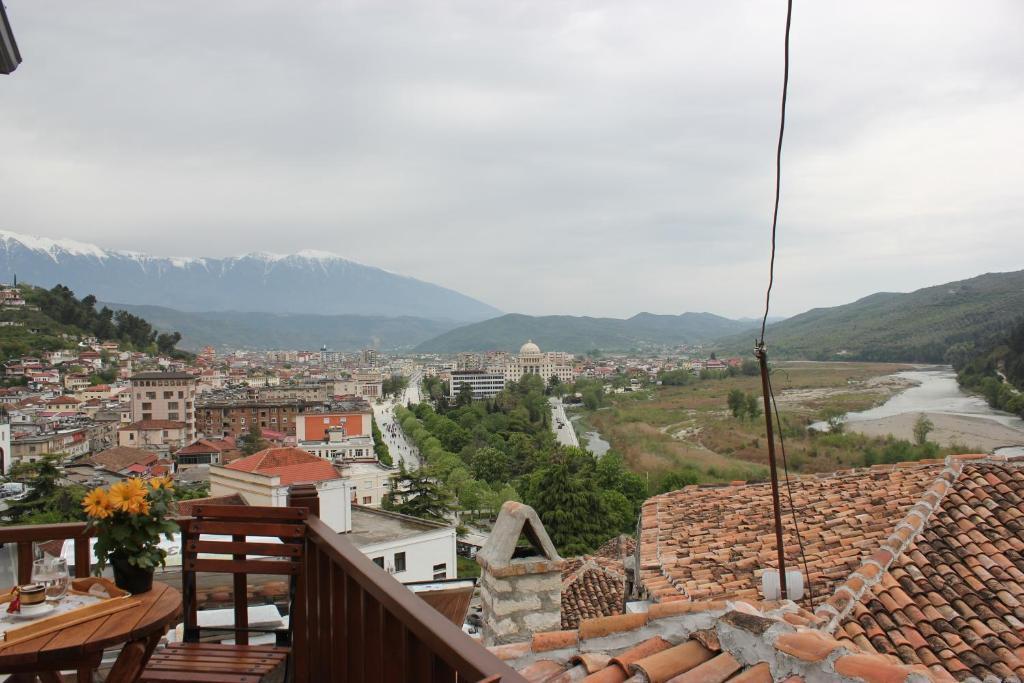 a view of a city from a balcony at Guesthouse Arjan in Berat