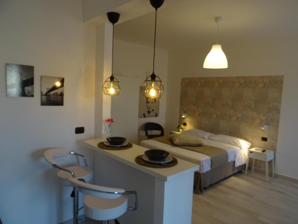 Postel nebo postele na pokoji v ubytování Holiday Rooms Portale Pirrera
