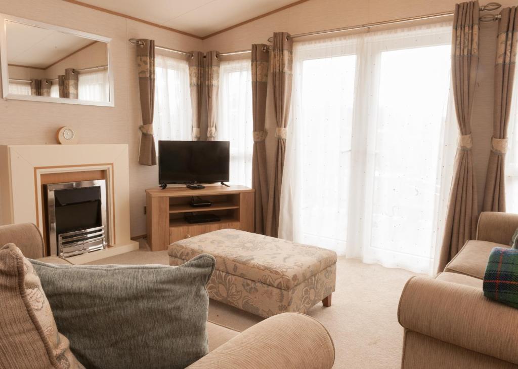 TV a/nebo společenská místnost v ubytování Ruapehu Lodge