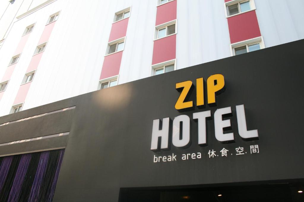 a zip hotel sign in front of a building at ZIP Hotel in Seoul