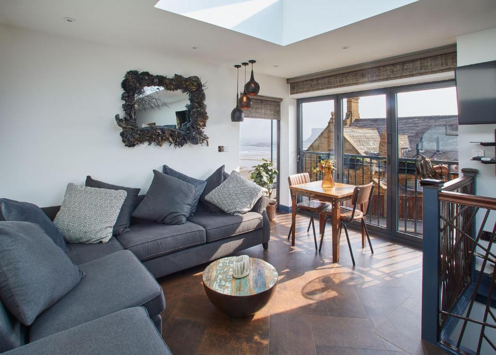 a living room with a couch and a table at Host & Stay - The Nook in Saltburn-by-the-Sea