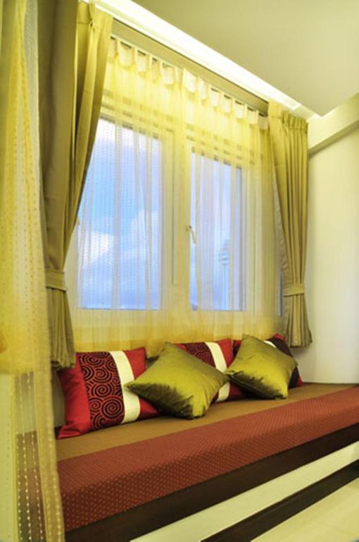 Postel nebo postele na pokoji v ubytování PS Hotel Phuket Patong - SHA Plus