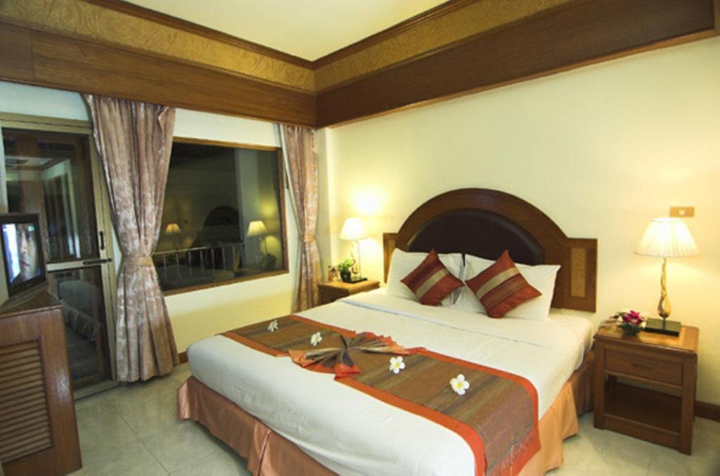 Postel nebo postele na pokoji v ubytování PS Hotel Phuket Patong - SHA Plus