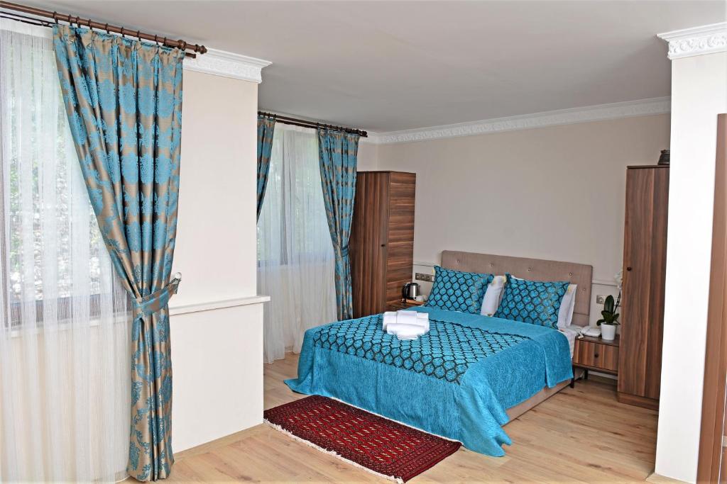 Postel nebo postele na pokoji v ubytování Sphendon Hotel