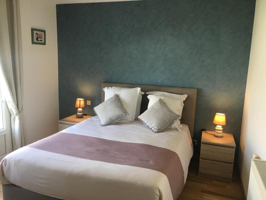 Postel nebo postele na pokoji v ubytování B&B de Saint Come de Fresné