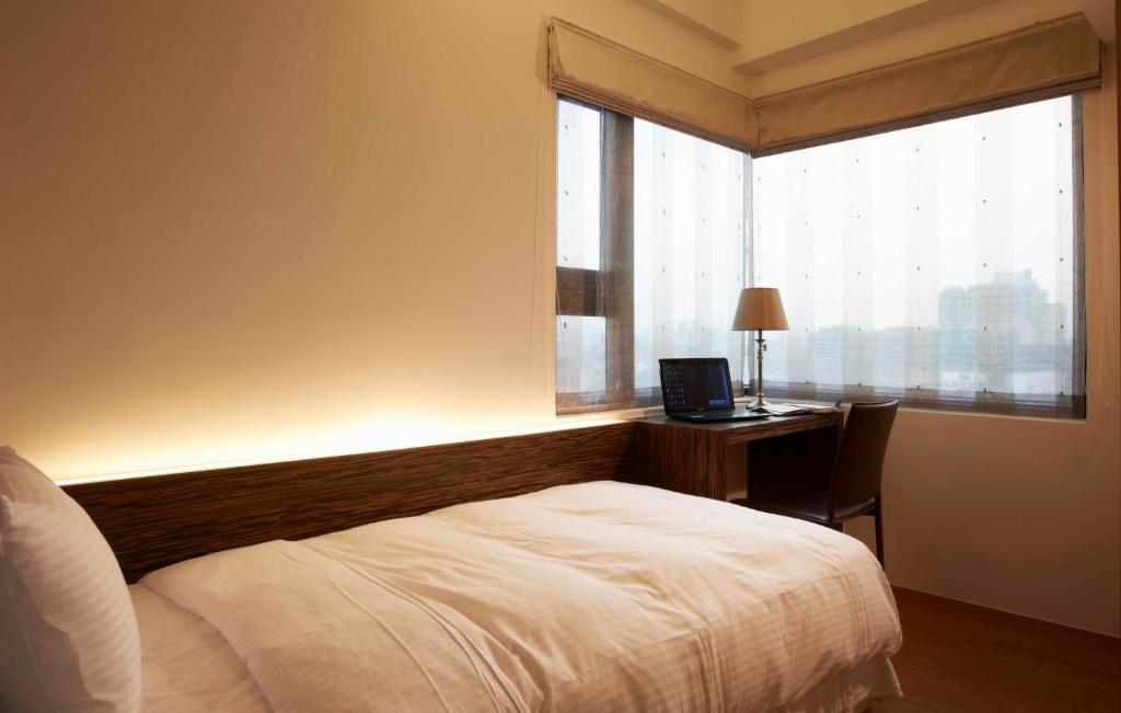 Postel nebo postele na pokoji v ubytování Master Hotel