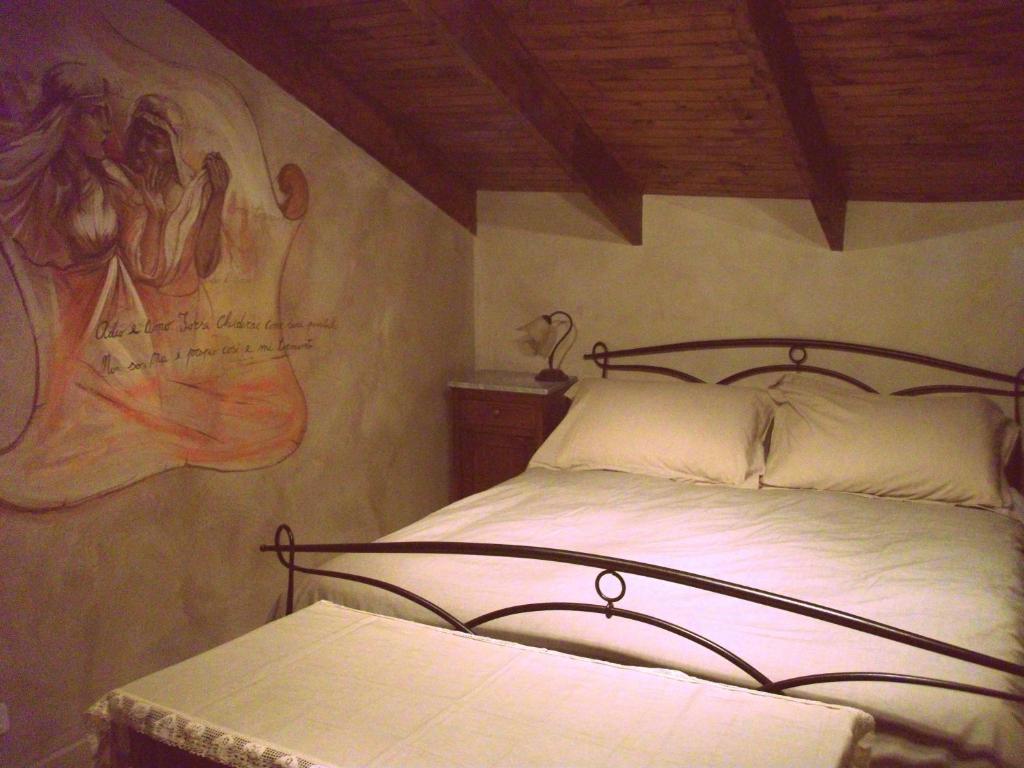 Letto o letti in una camera di Nostra Signora Del Lago