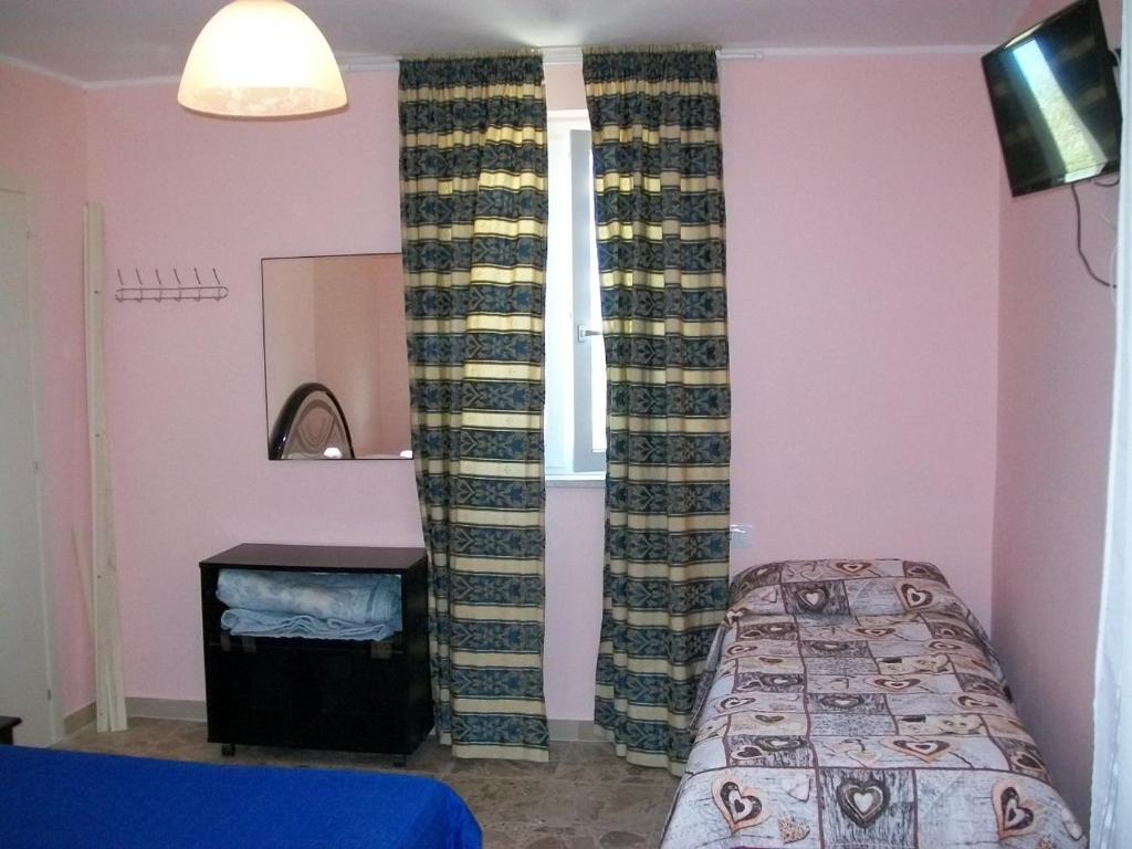 Letto o letti in una camera di Affittacamere il girasole