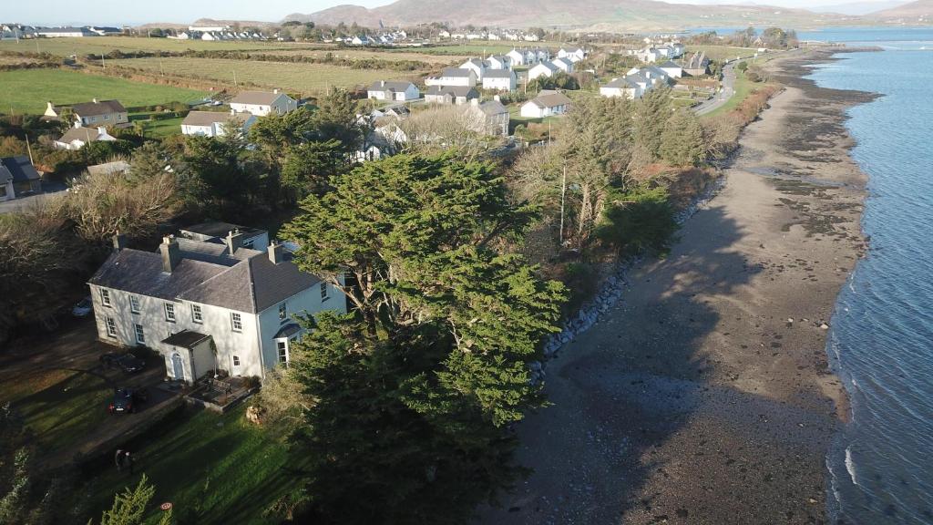 an aerial view of a house next to the water at Reenglas House in Valentia Island