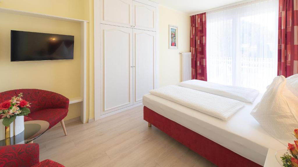 Postel nebo postele na pokoji v ubytování Pension Helios