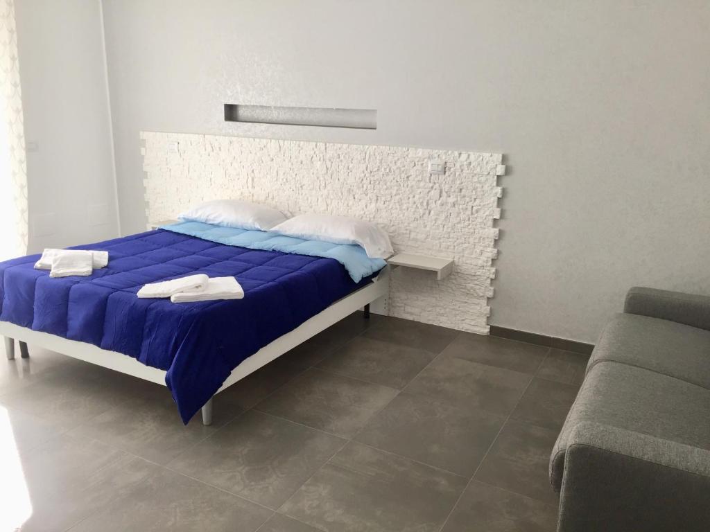 Łóżko lub łóżka w pokoju w obiekcie IL VIAGGIATORE VIA PIAVE