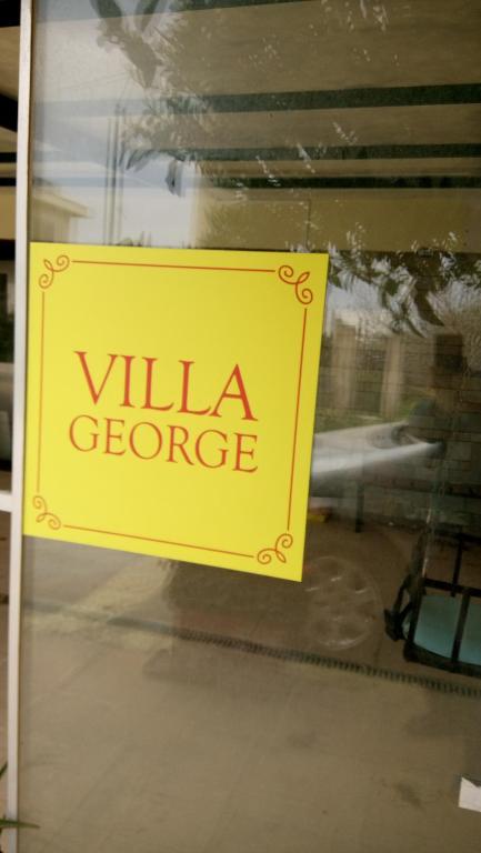 Un certificat, premiu, logo sau alt document afișat la Villa George - Family Holidays
