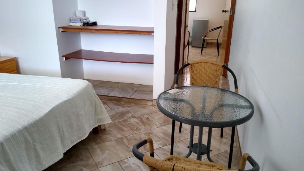 Postel nebo postele na pokoji v ubytování Hospedaje Puesta de Sol