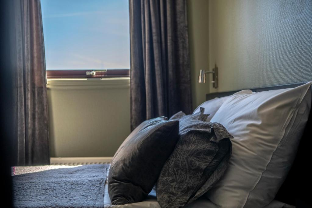 Postel nebo postele na pokoji v ubytování Hotel Fredrikstad