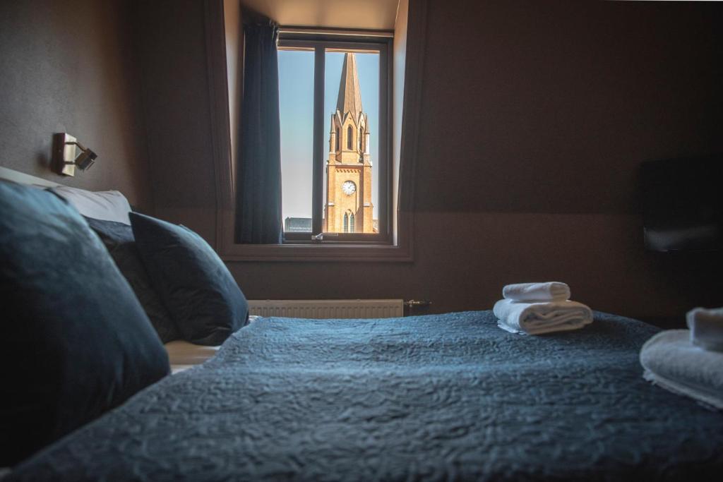 Postel nebo postele na pokoji v ubytování Hotel Fredrikstad