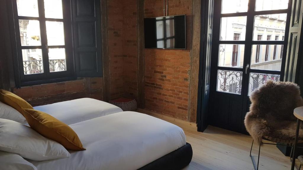 Postel nebo postele na pokoji v ubytování 13 suites
