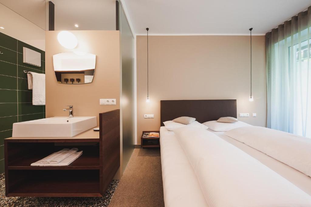 Postel nebo postele na pokoji v ubytování Hotel Braunsbergerhof