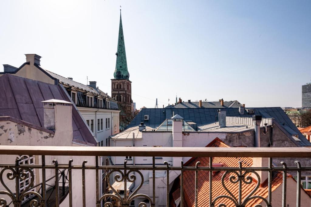 a view of a city from a balcony at Old Riga Aldaru street 2 Level Apartment With Terrace in Rīga