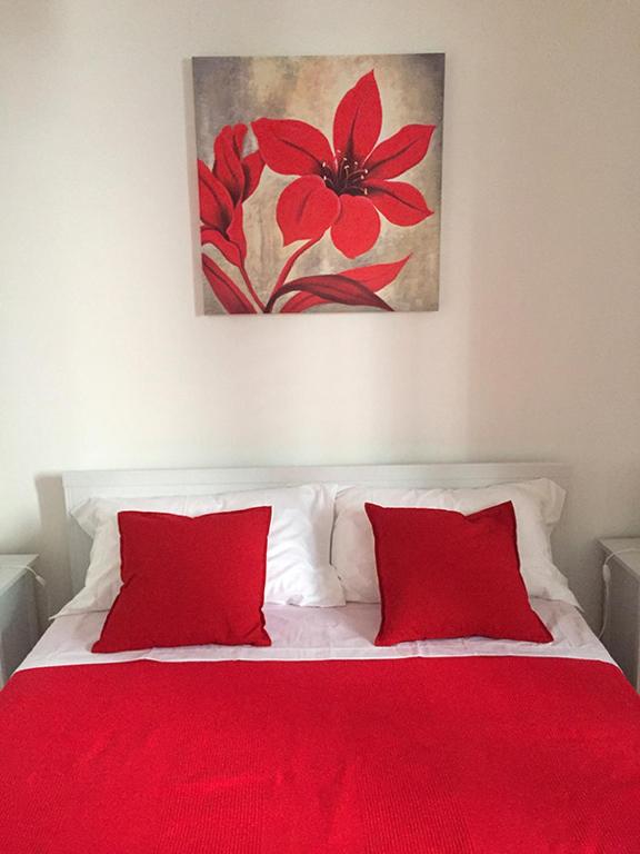 Łóżko lub łóżka w pokoju w obiekcie B&B Scilla Mare