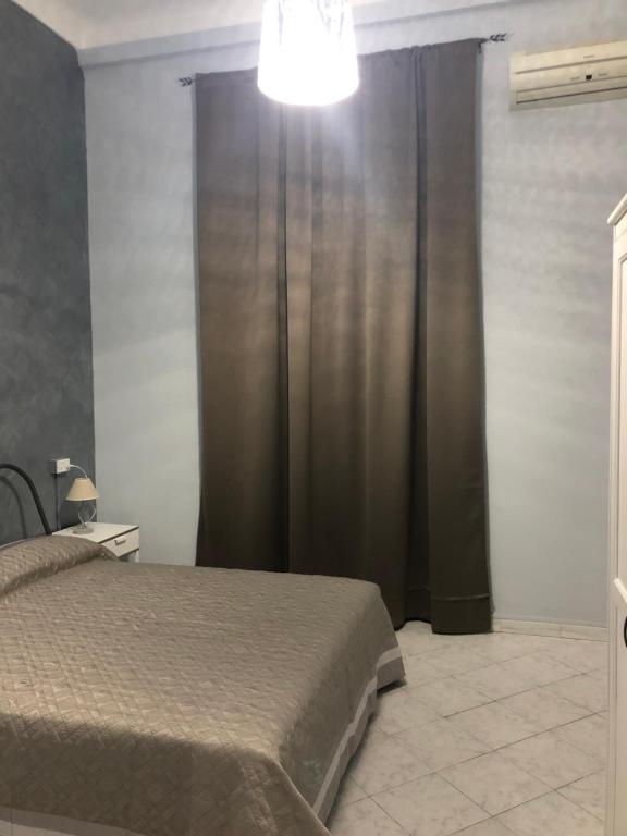 Łóżko lub łóżka w pokoju w obiekcie Affittacamere Roma