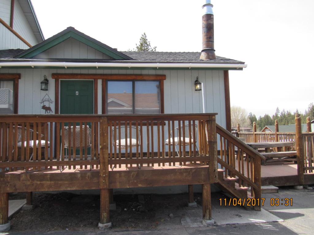 a large wooden deck in front of a house at Moonridge Ski Pad in Big Bear Lake