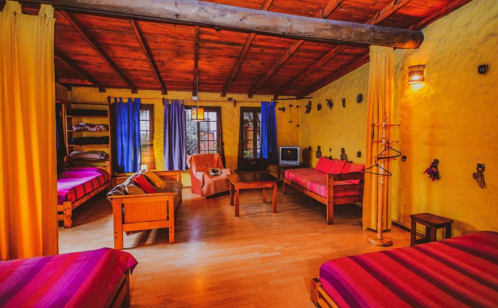 Postel nebo postele na pokoji v ubytování Hostal El Punto