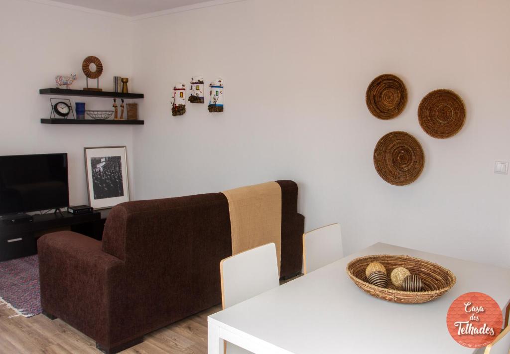 a living room with a couch and a table at Peniche Roof View House - Beach Village in Peniche