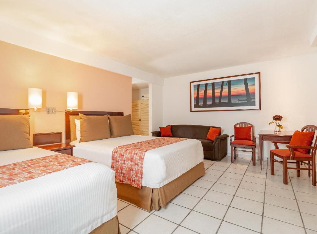 Postel nebo postele na pokoji v ubytování Hotel Veracruz Centro Histórico
