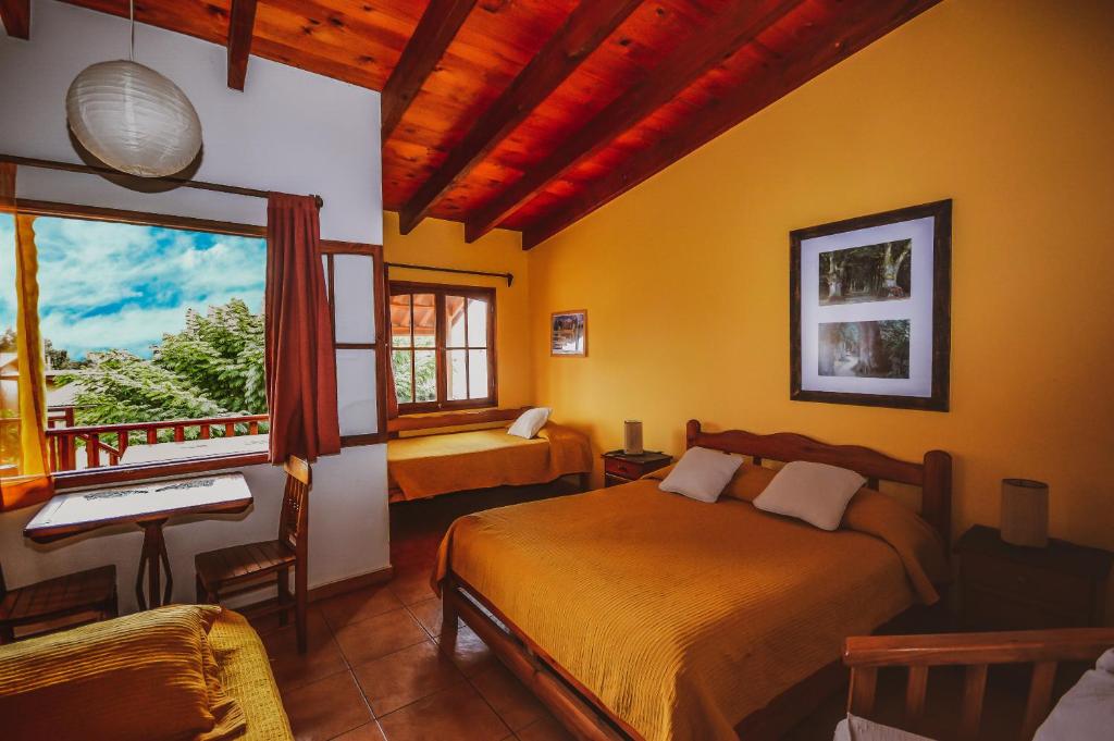 Postel nebo postele na pokoji v ubytování Hostal El Punto