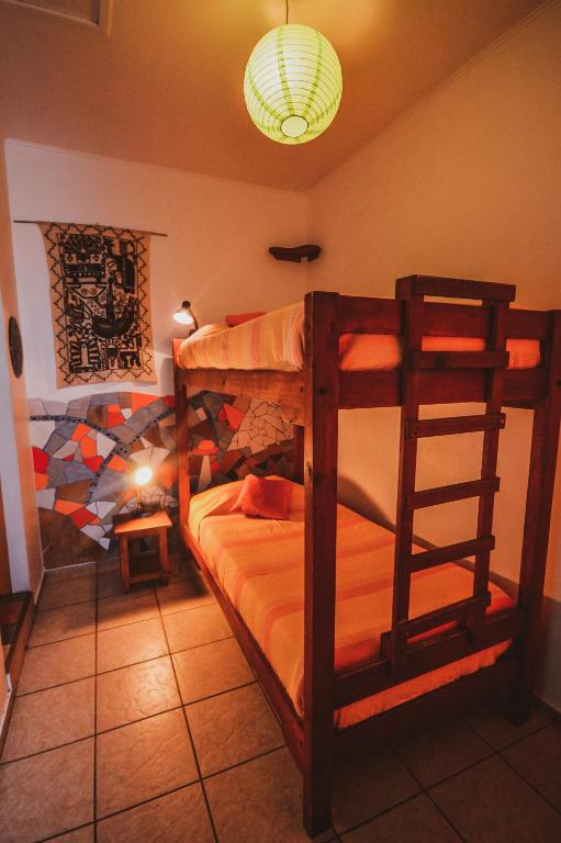 Postel nebo postele na pokoji v ubytování Hostal El Punto