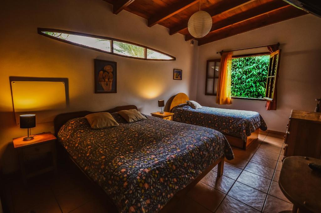 Postel nebo postele na pokoji v ubytování Hostal El Punto