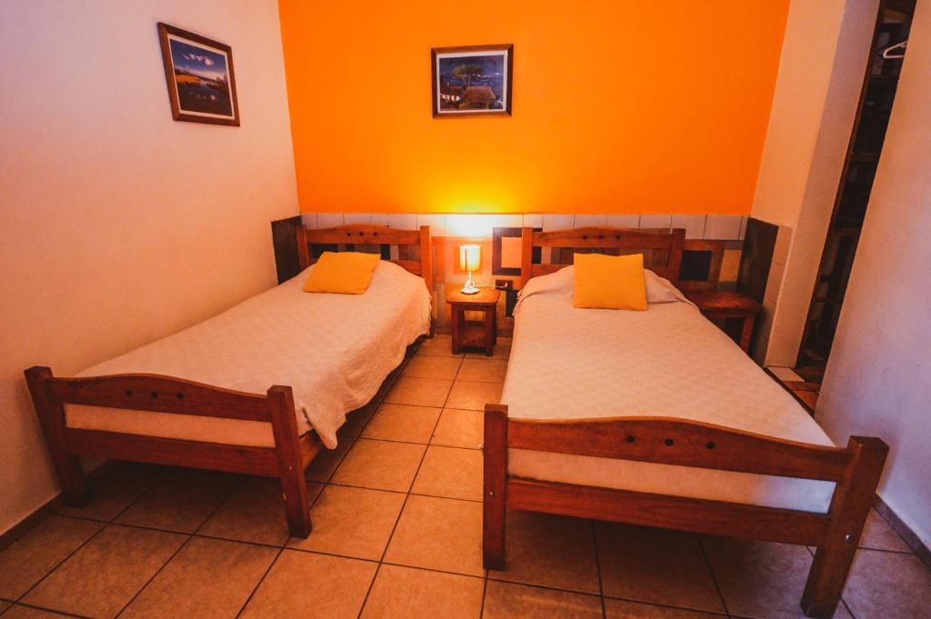 Postel nebo postele na pokoji v ubytování Hostal El Punto