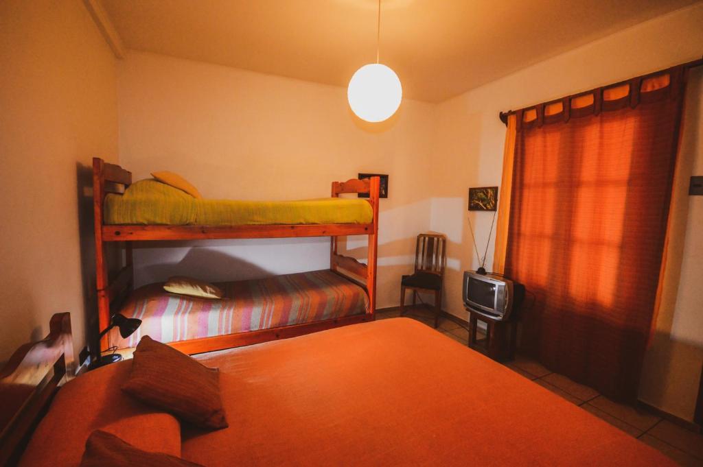 Postel nebo postele na pokoji v ubytování Hostal El Punto