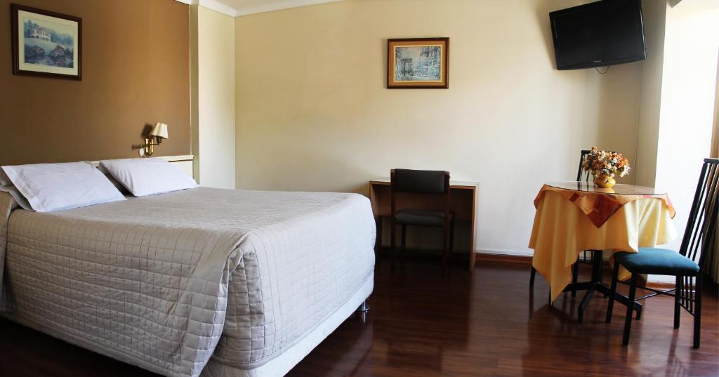 Postel nebo postele na pokoji v ubytování Hotel Premier