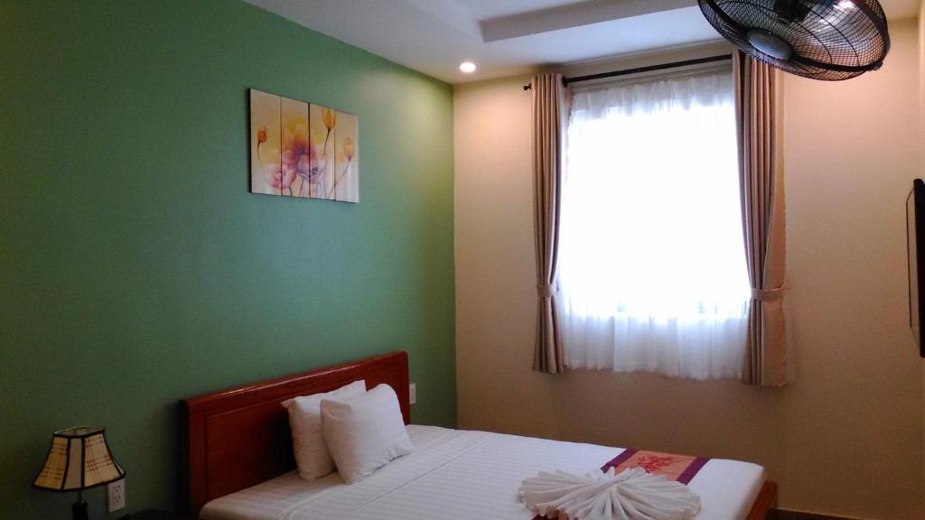 Postel nebo postele na pokoji v ubytování Tabii hotel