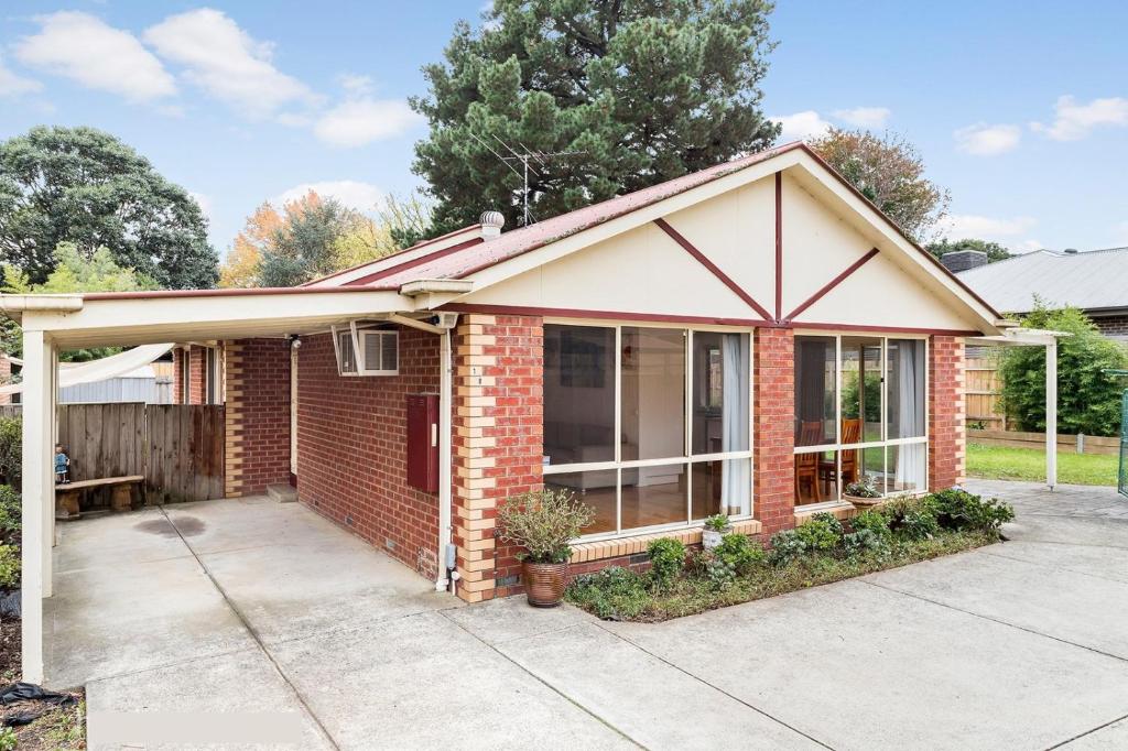 a brick house with a porch and a patio at Maroondah Pet Friendly 3 Bedroom House in Kilsyth in Kilsyth