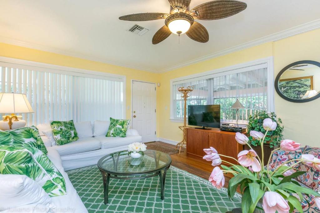 a living room with a couch and a table at Floral Oasis in Fort Lauderdale