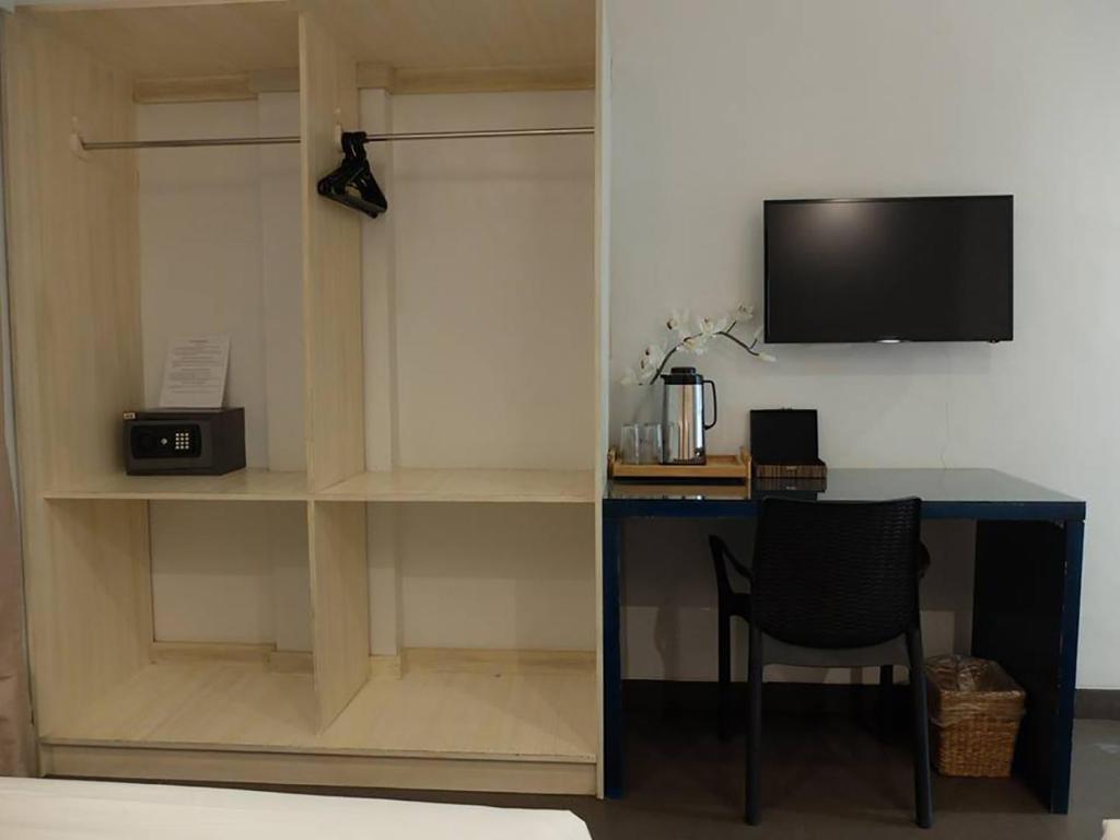 TV a/nebo společenská místnost v ubytování Treetop Suites