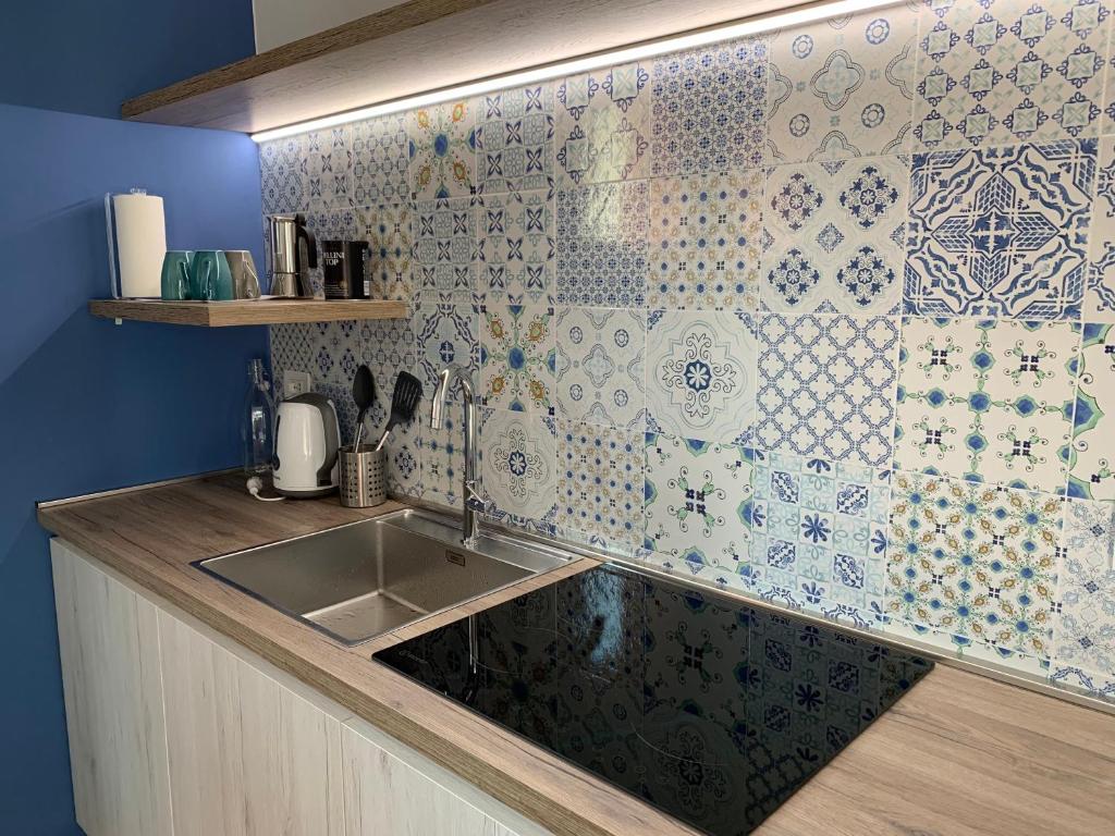 Kuchyň nebo kuchyňský kout v ubytování Le Querce Apartments