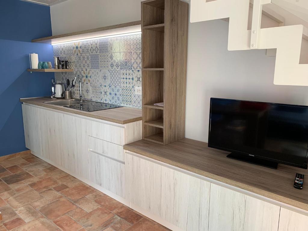 Kuchyň nebo kuchyňský kout v ubytování Le Querce Apartments