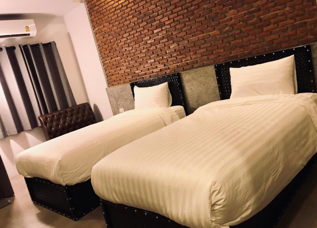 Postel nebo postele na pokoji v ubytování Pimchanok Resort