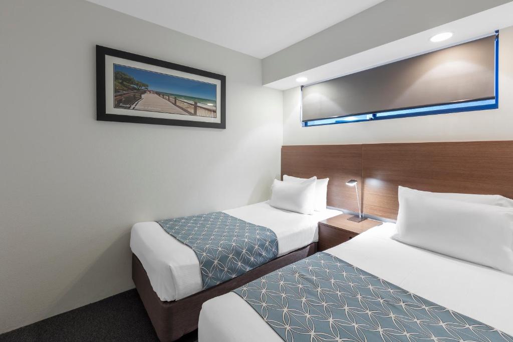 Postel nebo postele na pokoji v ubytování Ramada Resort by Wyndham Golden Beach