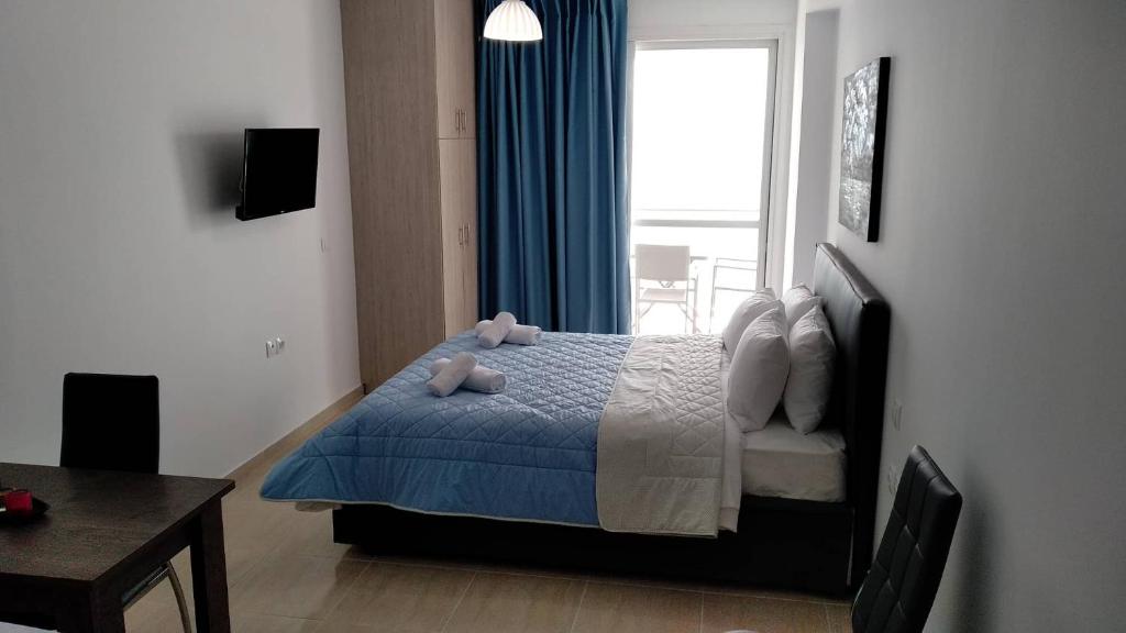Postel nebo postele na pokoji v ubytování Violetta Studios