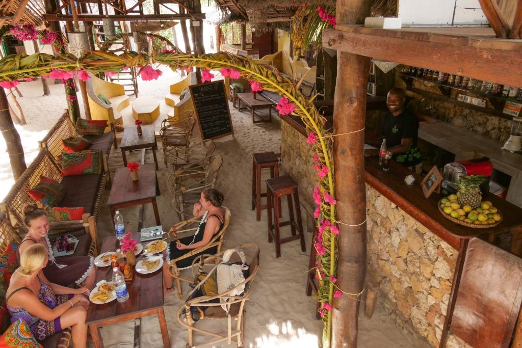 an overhead view of a restaurant with people sitting at tables at Demani Lodge Zanzibar in Paje