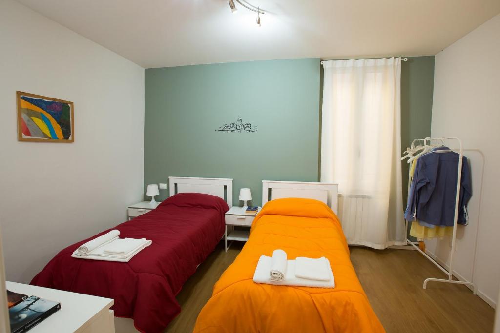 Łóżko lub łóżka w pokoju w obiekcie Guasto Apartment