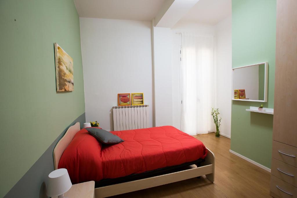 Łóżko lub łóżka w pokoju w obiekcie Guasto Apartment